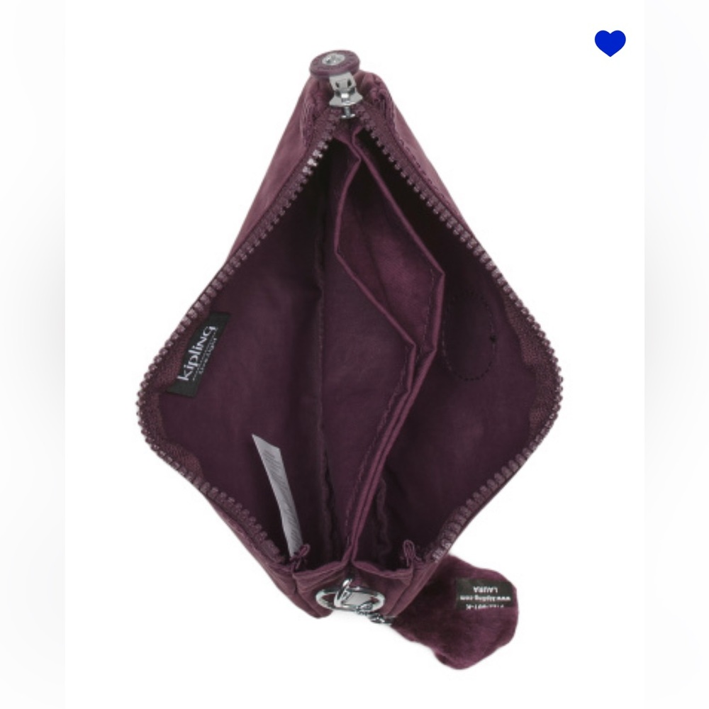 Kipling organizer used but in good condition with a slight stain purple